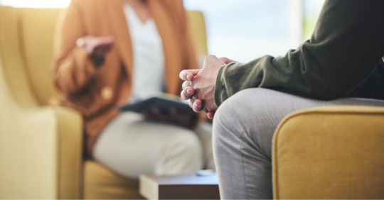 Man talking to counselor in therapy